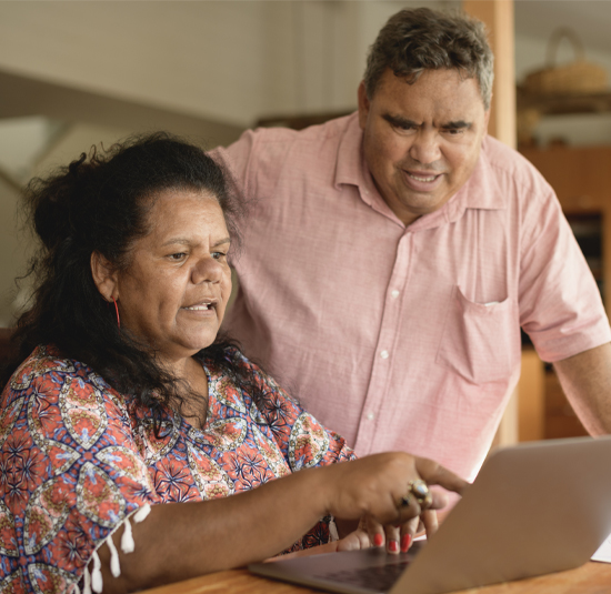 Photo of wife and husband working on computer